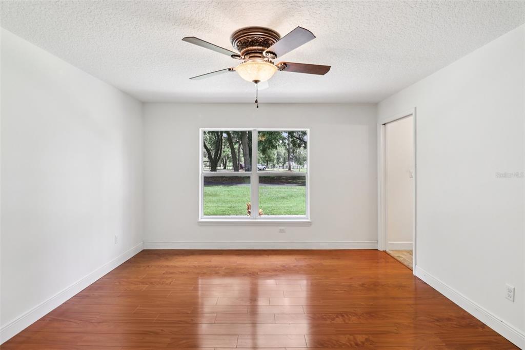 40610 Babb Road Umatilla, FL 32784 - Photo 21 of 45 an empty room with windows and ceiling fan