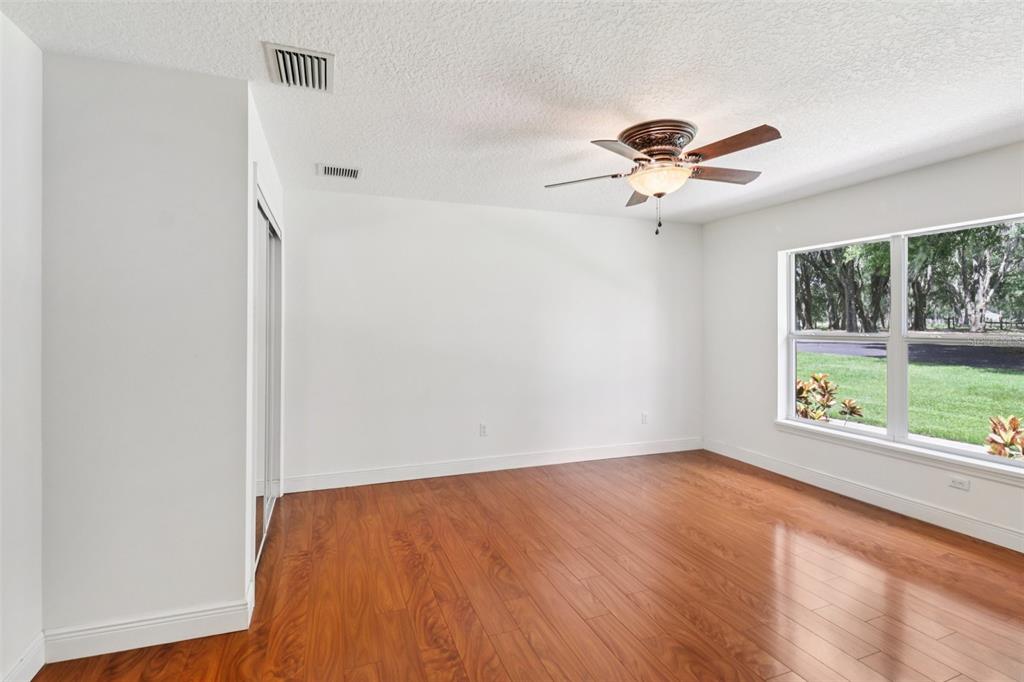 40610 Babb Road Umatilla, FL 32784 - Photo 23 of 45 an empty room with a window and a ceiling fan