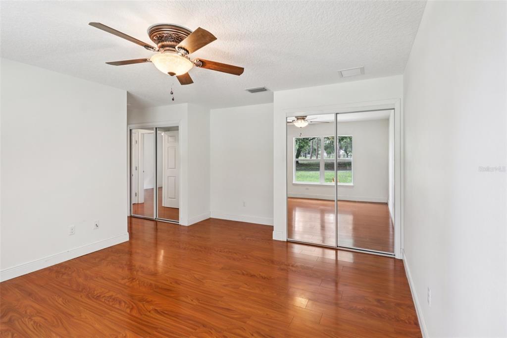 40610 Babb Road Umatilla, FL 32784 - Photo 24 of 45 an empty room with wooden floor and windows