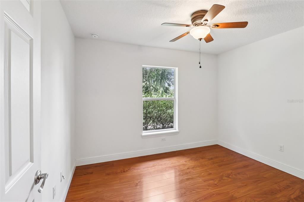 40610 Babb Road Umatilla, FL 32784 - Photo 26 of 45 an empty room with a window and a fan