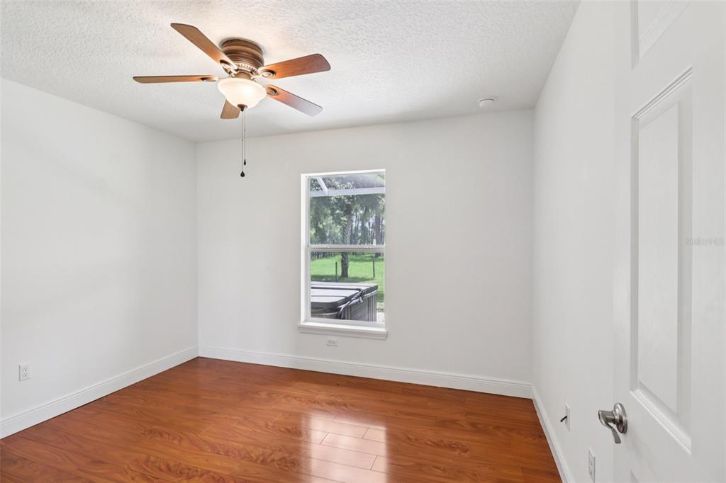 40610 Babb Road Umatilla, FL 32784 - Photo 28 of 45 an empty room with a window and a ceiling fan
