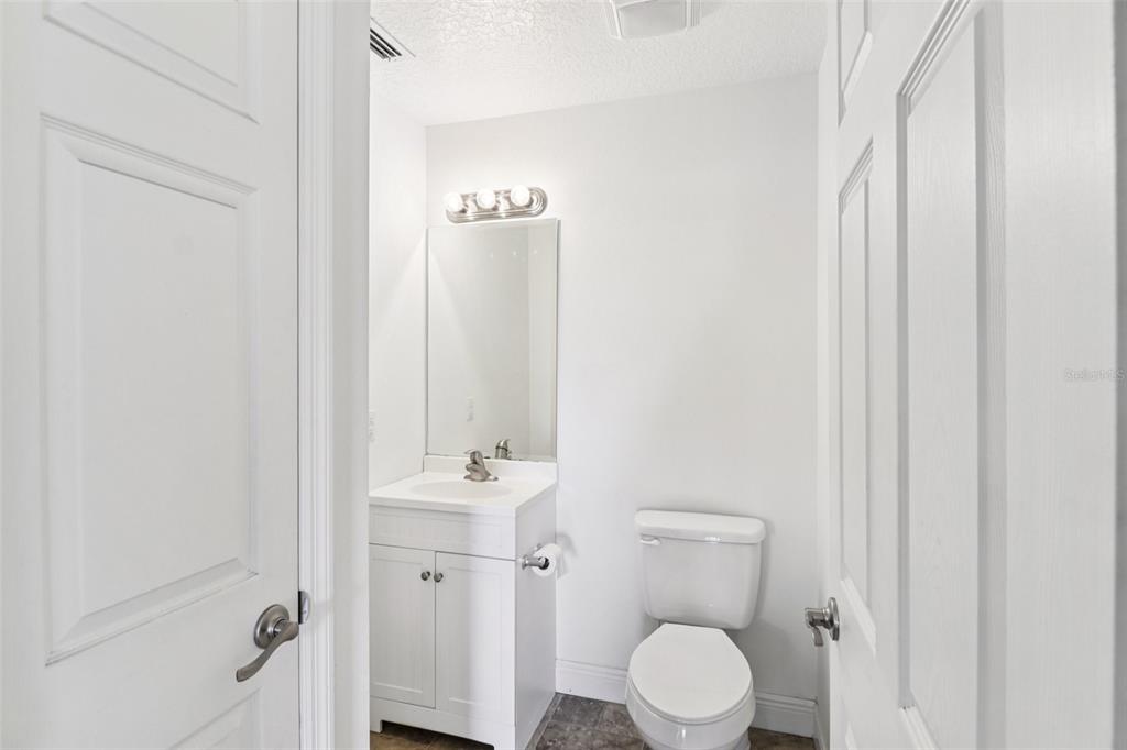 40610 Babb Road Umatilla, FL 32784 - Photo 29 of 45 a bathroom with a toilet sink and shower curtain