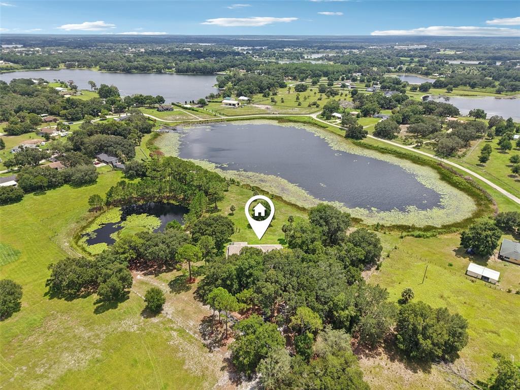 40610 Babb Road Umatilla, FL 32784 - Photo 37 of 45 a view of a lake with a city view