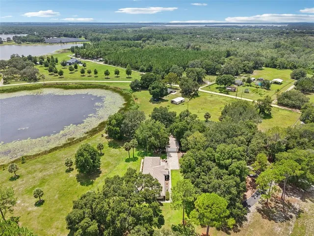 a view of a city with green field