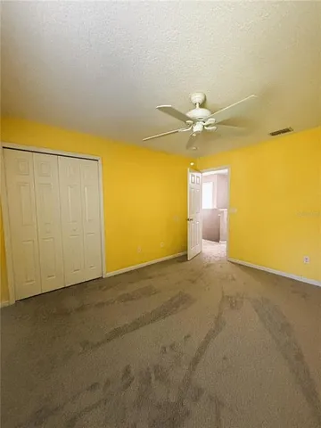 a bathroom with a sink vanity and toilet