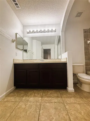 a bathroom with a toilet bathtub and shower