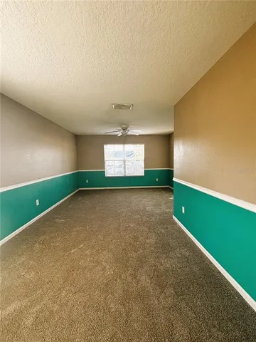 a view of empty room with garage and window