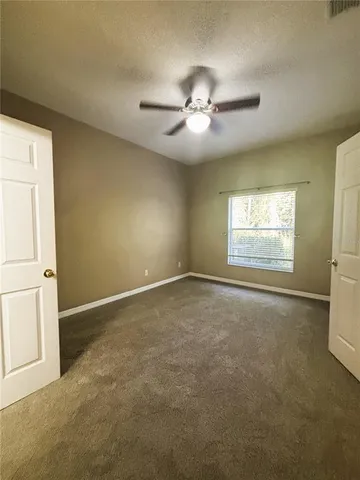 a bathroom with a sink a toilet a mirror and bathtub
