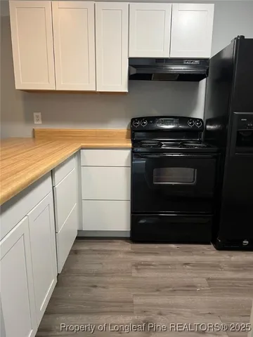 a close view of a stove and a refrigerator