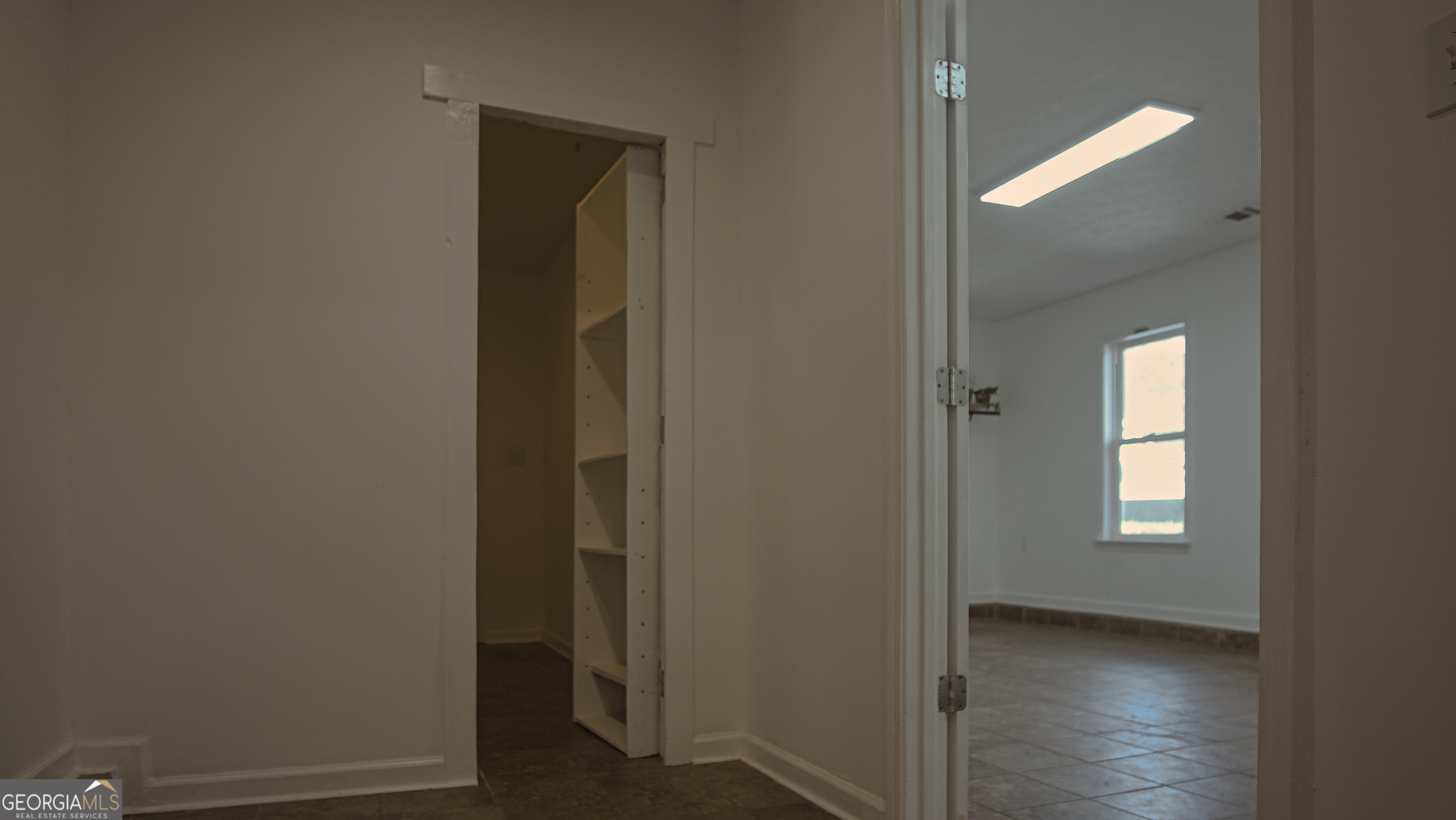 135 Dixie Lane Covington, GA 30014 - Photo 54 of 85 Hallway to Office and Safe Room