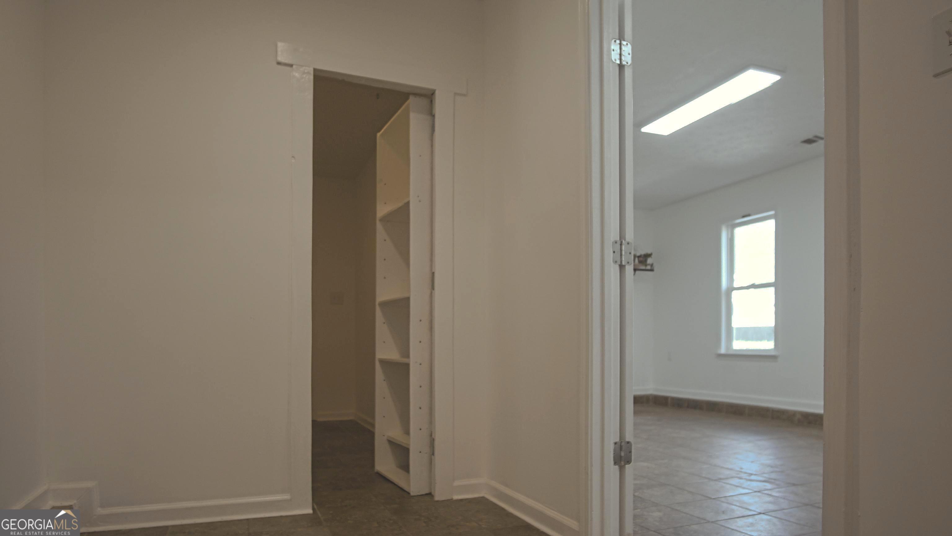 135 Dixie Lane Covington, GA 30014 - Photo 55 of 85 Hallway to Office and Safe Room