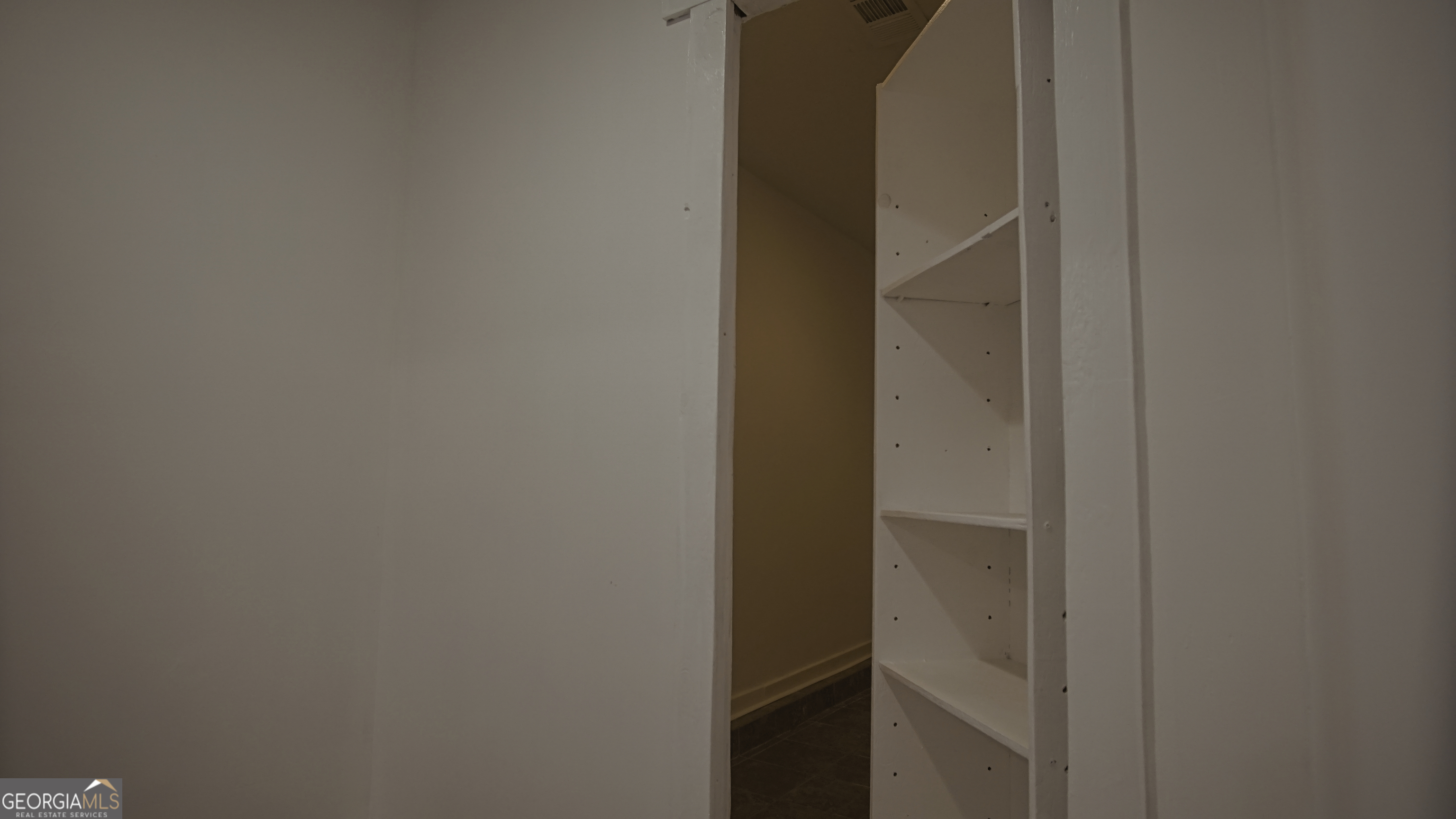 135 Dixie Lane Covington, GA 30014 - Photo 56 of 85 Hidden Bookcase Door to Safe Room