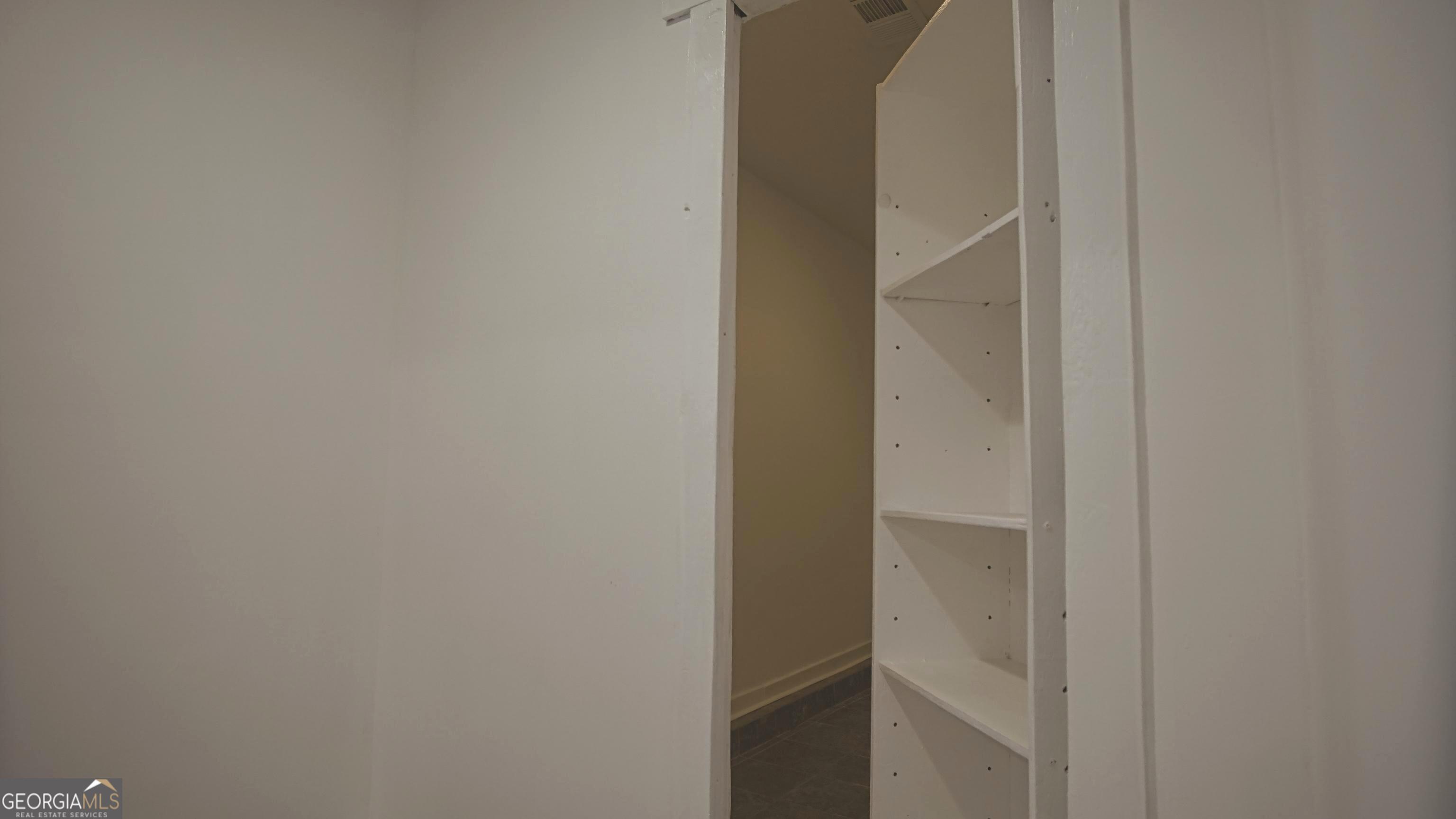 135 Dixie Lane Covington, GA 30014 - Photo 57 of 85 Hidden Bookcase Door to Safe Room