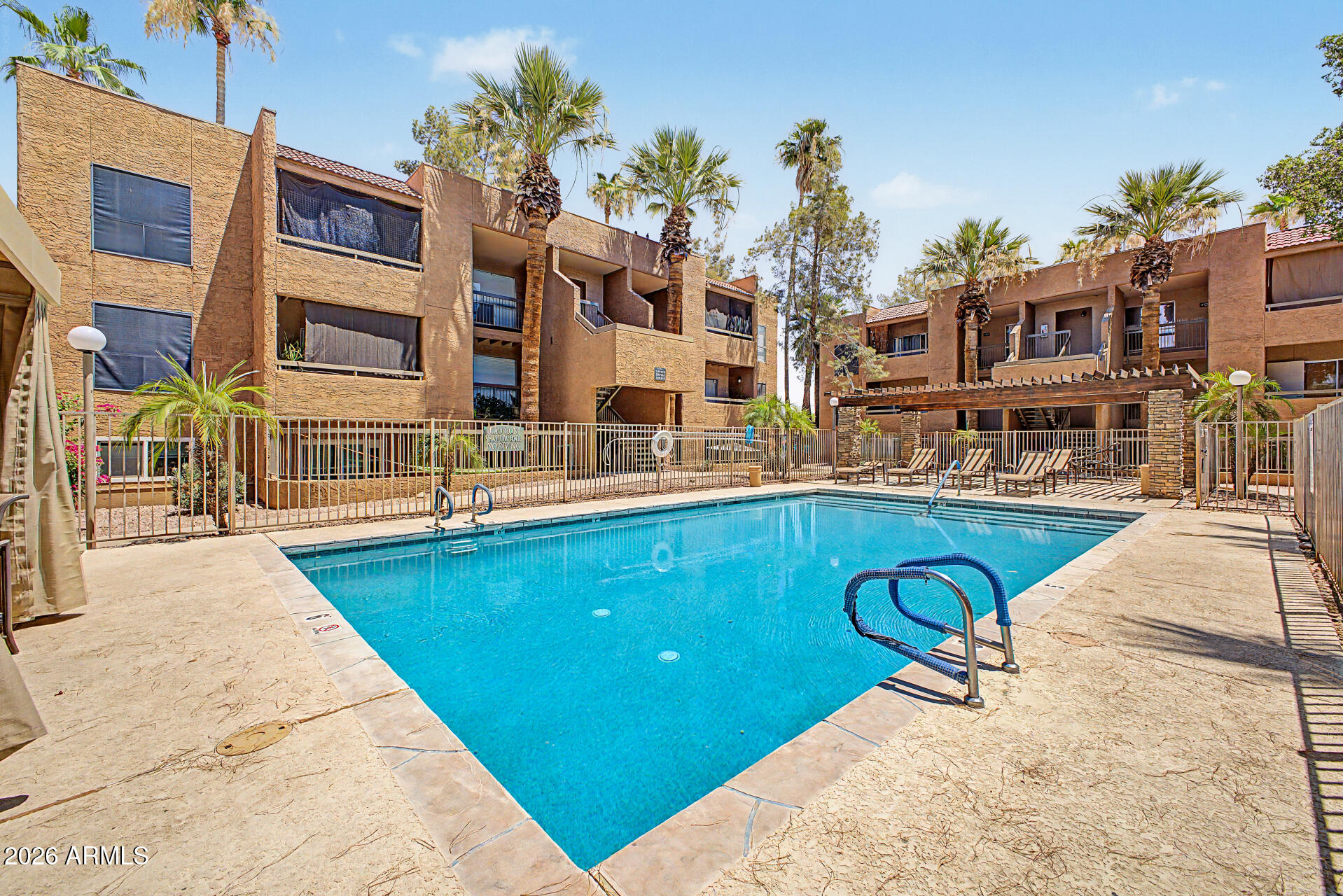 2625 East Indian School Road, Unit 227 Phoenix, AZ 85016 - Photo 25 of 31 a view of a house with swimming pool