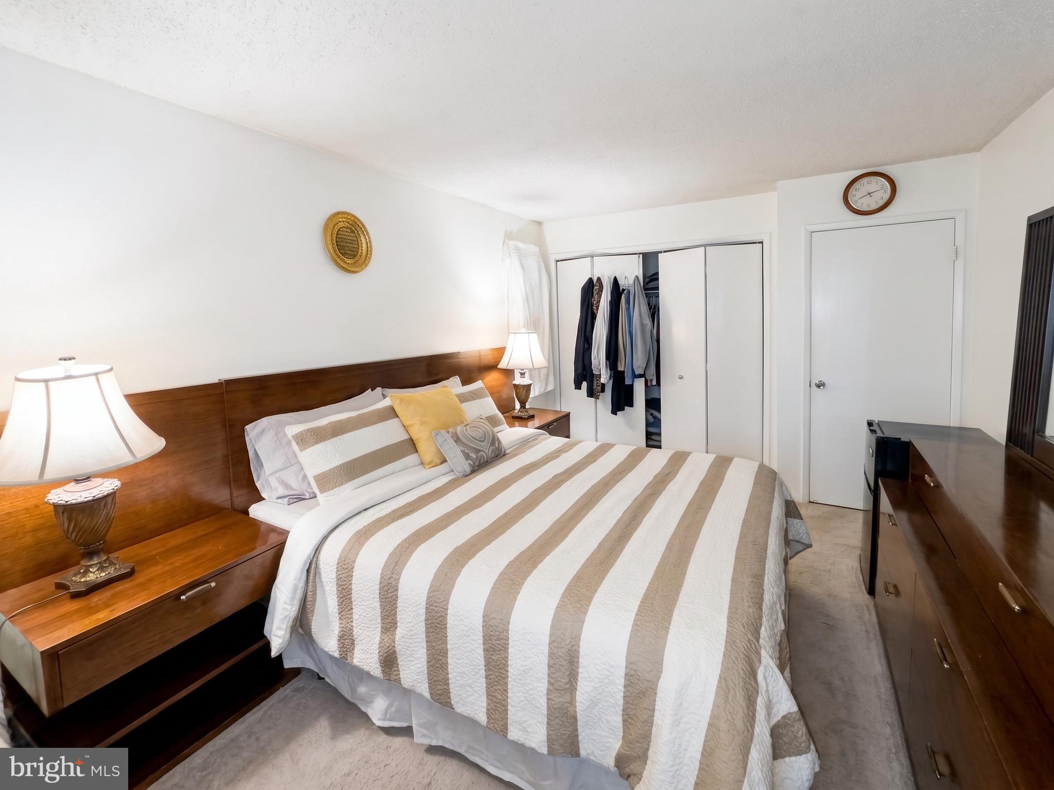 1822 Metzerott Road, Unit 401 Hyattsville, MD 20783 - Photo 14 of 22 a bed room with a bed and a chair