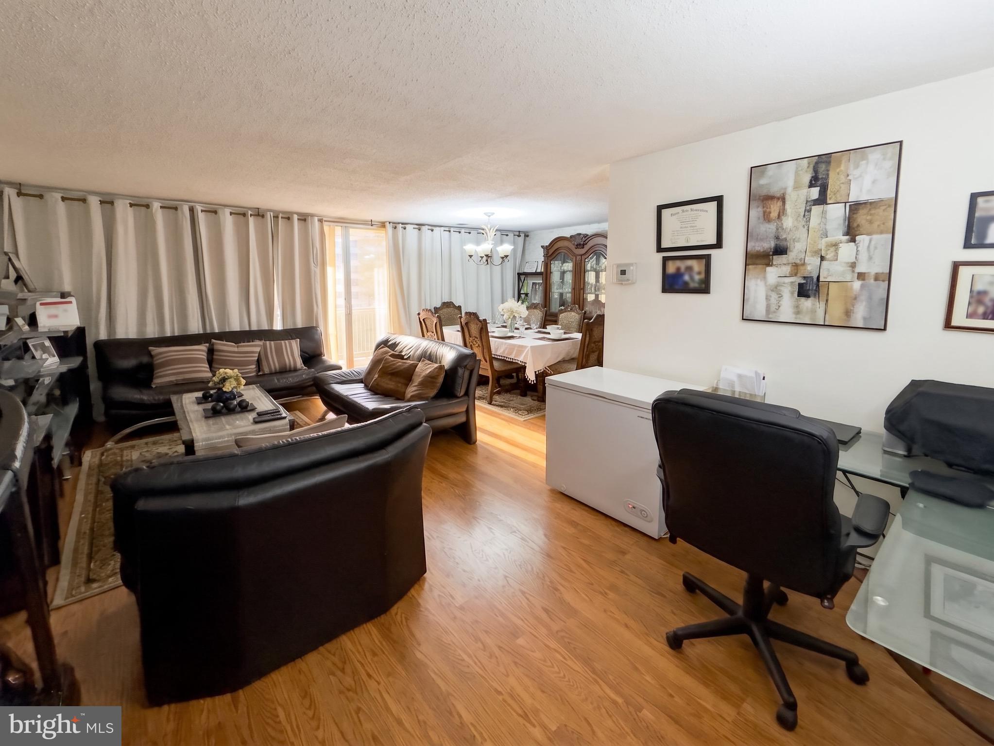 1822 Metzerott Road, Unit 401 Hyattsville, MD 20783 - Photo 3 of 22 a living room with furniture and a window