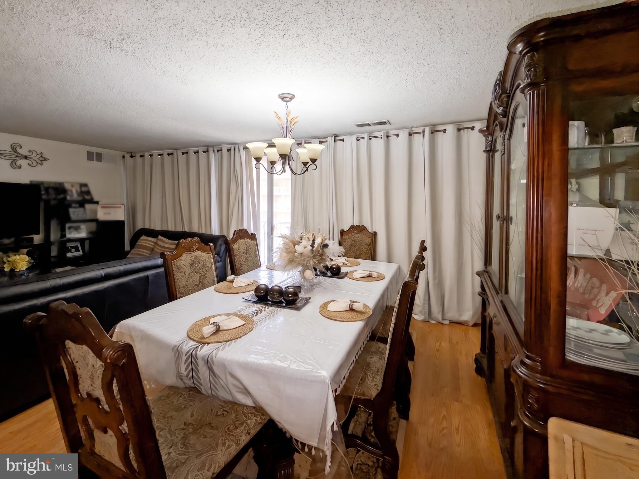 1822 Metzerott Road, Unit 401 Hyattsville, MD 20783 - Photo 10 of 22 a dining room with furniture and window
