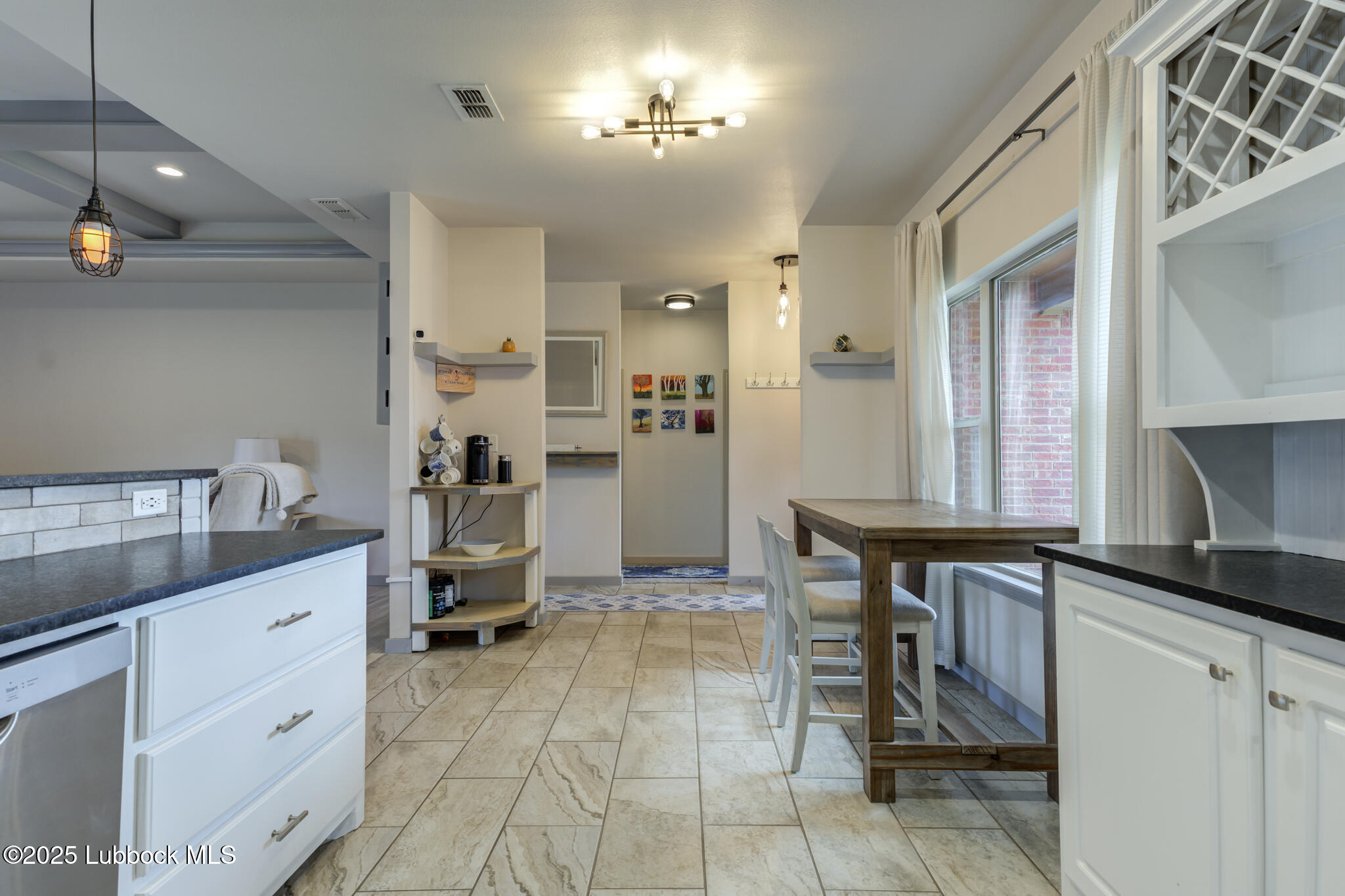 5218 Lehigh Street Lubbock, TX 79416 - Photo 22 of 39 a kitchen with a sink cabinets and appliances