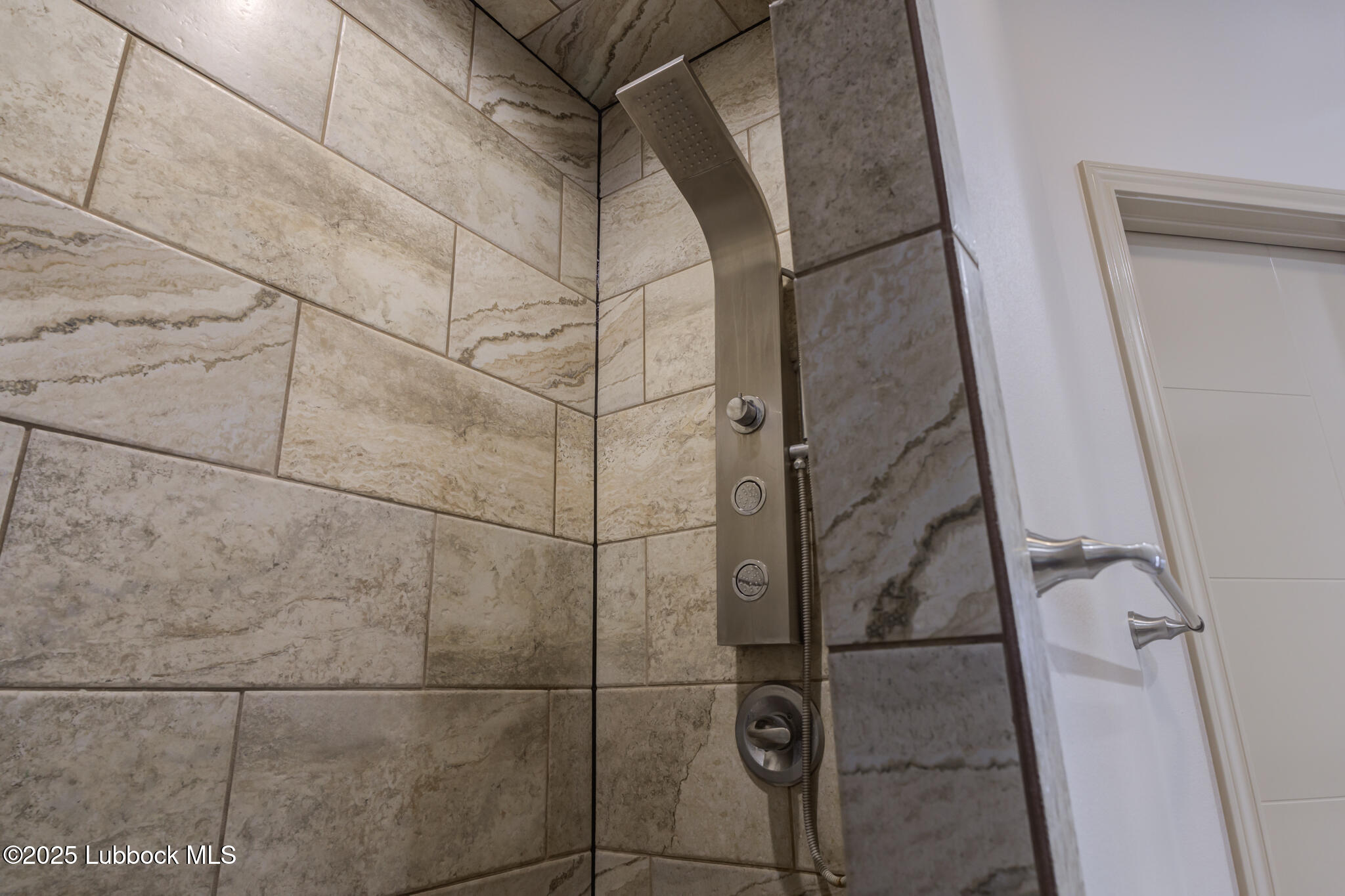 5218 Lehigh Street Lubbock, TX 79416 - Photo 28 of 39 a bathroom with a shower