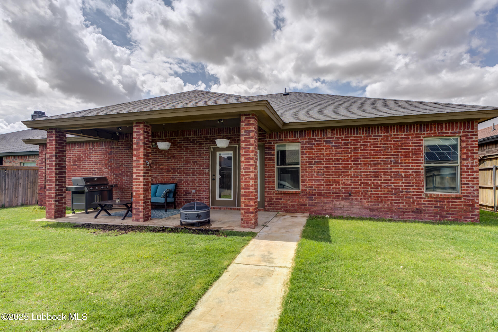 5218 Lehigh Street Lubbock, TX 79416 - Photo 39 of 39 a view of a house with a yard and sitting area