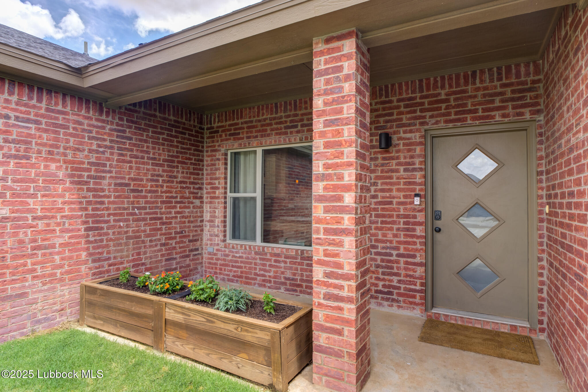 5218 Lehigh Street Lubbock, TX 79416 - Photo 4 of 39 a front view of a house with a garden
