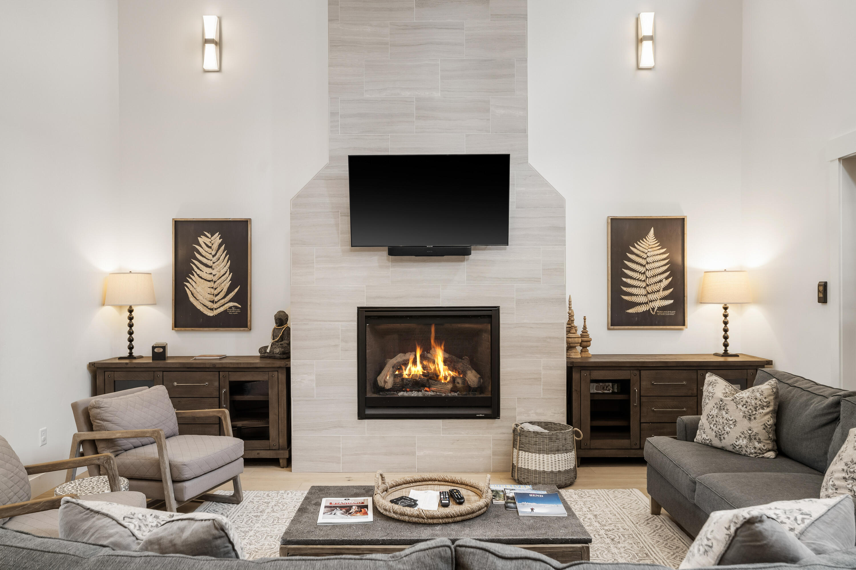 56302 Sable Rock Loop, Unit 255 Bend, OR 97707 - Photo 10 of 65 a living room with furniture a fireplace and a flat screen tv