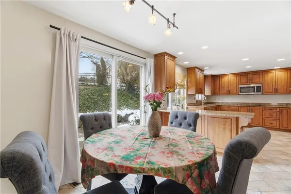 a view of a dining room with furniture window and outside view