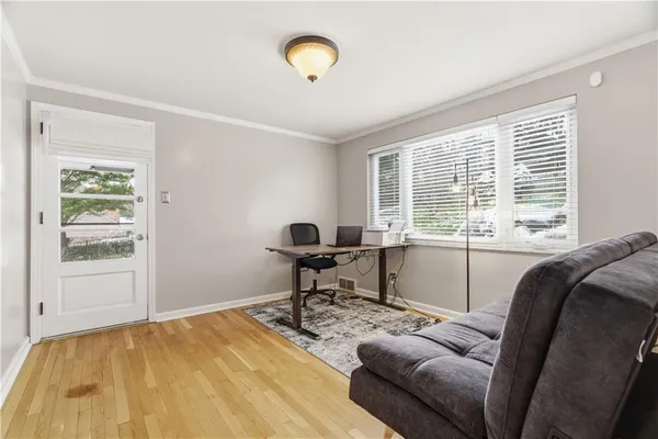a workspace with furniture and a window