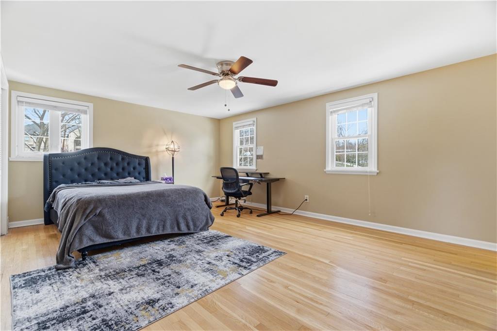 1800 Murdstone Road Upper St. Clair, PA 15241 - Photo 15 of 29 a bedroom with a bed and a chandelier