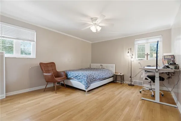 a bedroom with a bed a table and chair