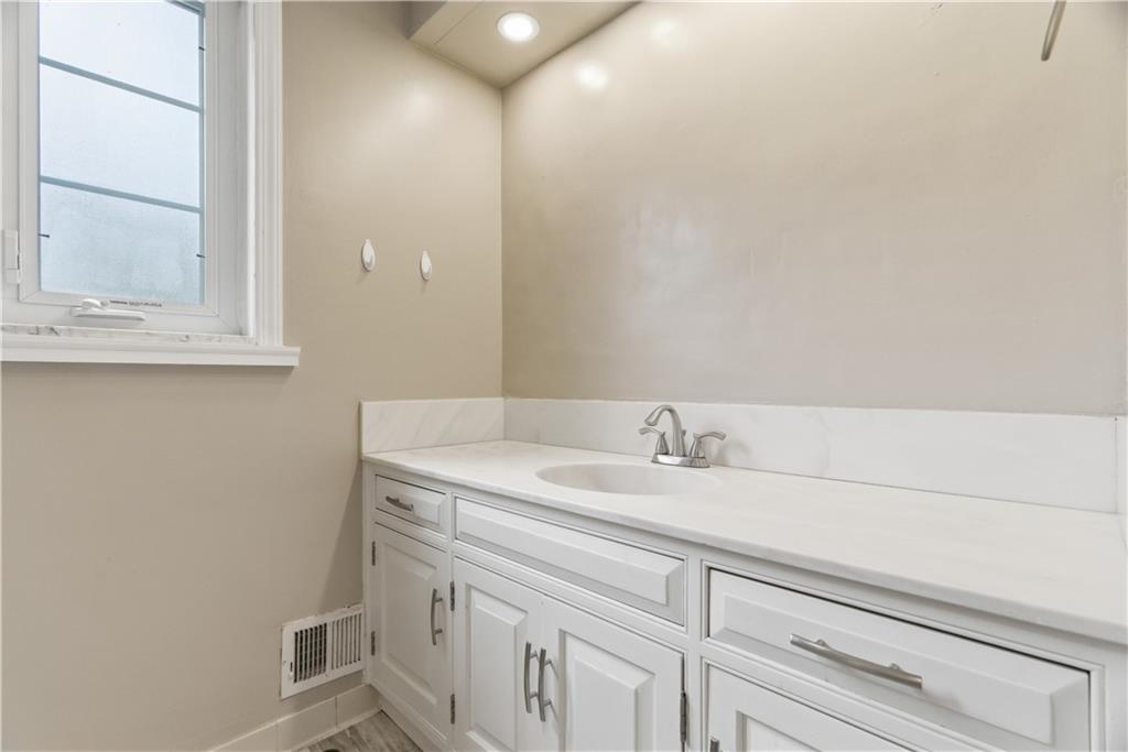 1800 Murdstone Road Upper St. Clair, PA 15241 - Photo 22 of 29 a bathroom with a sink and a mirror