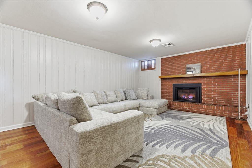 1800 Murdstone Road Upper St. Clair, PA 15241 - Photo 23 of 29 a living room with furniture and a fireplace