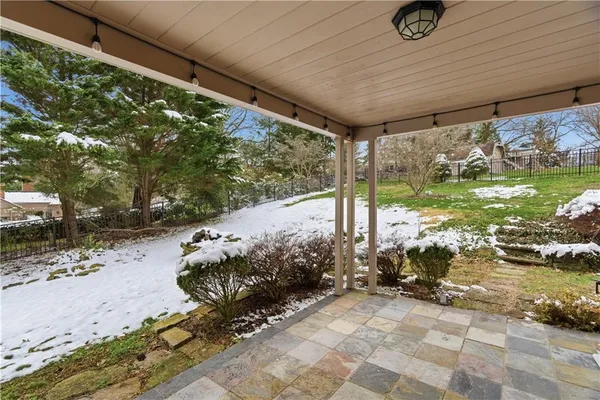 a view of a backyard of the house