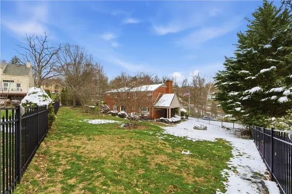 a view of a backyard with sitting area