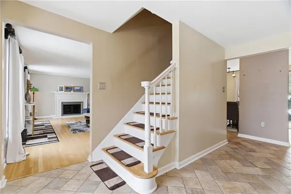 a view of a livingroom with wooden floor and white walls