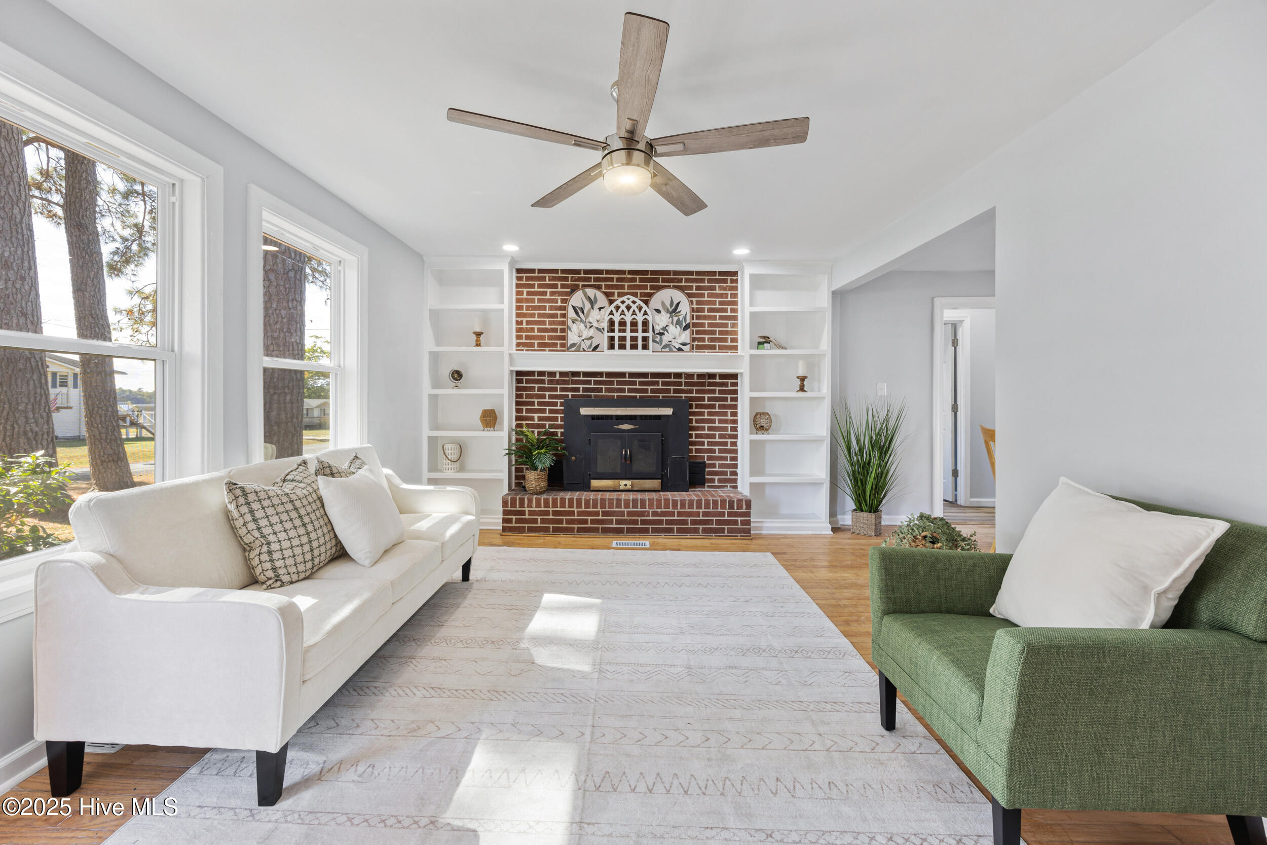 115 Pine Street Hertford, NC 27944 - Photo 3 of 24 Cozy fireplace and built-ins