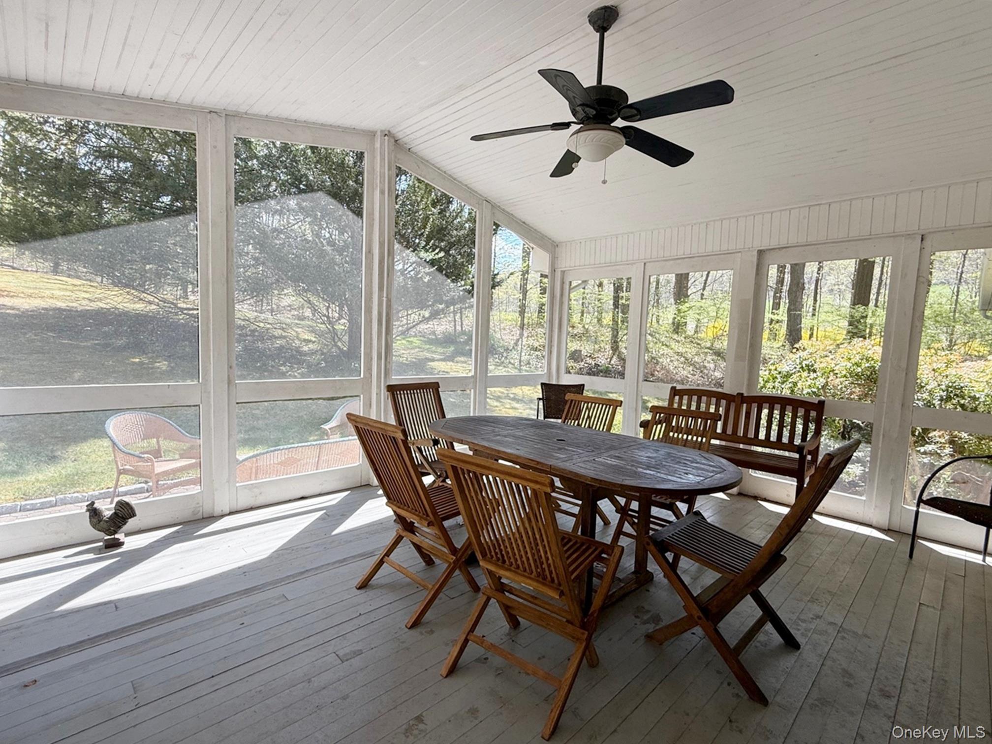230 Cooper Road Millerton, NY 12546 - Photo 16 of 20 a view of a dining room with furniture window and outside view