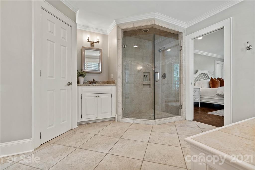1305 Lilac Road Charlotte, NC 28209 - Photo 11 of 47 a bathroom with a shower and a sink