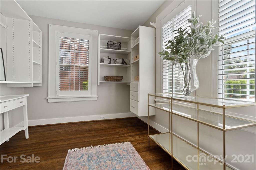 1305 Lilac Road Charlotte, NC 28209 - Photo 12 of 47 a kitchen with windows and chandelier