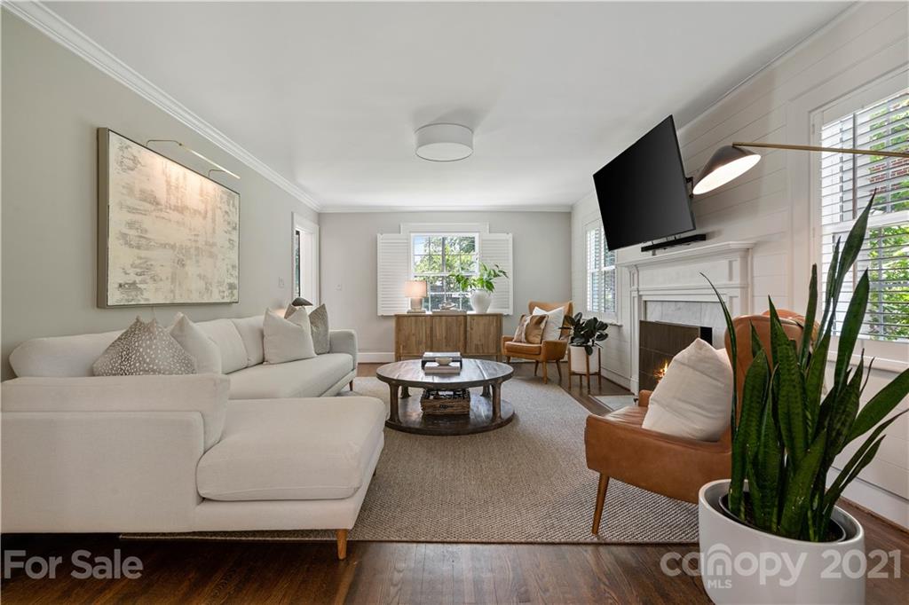 1305 Lilac Road Charlotte, NC 28209 - Photo 13 of 47 a living room with furniture fireplace and a flat screen tv