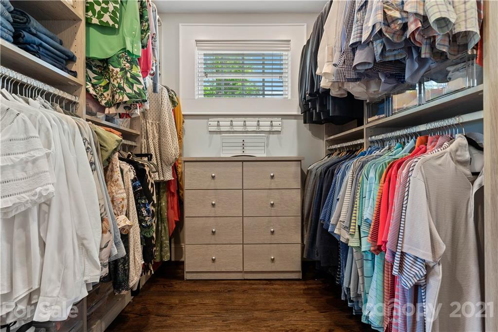 1305 Lilac Road Charlotte, NC 28209 - Photo 19 of 47 a view of walk in closet with clothes
