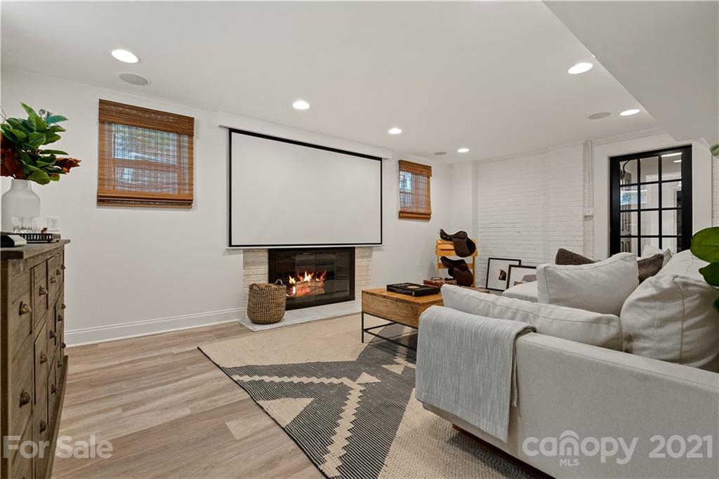 1305 Lilac Road Charlotte, NC 28209 - Photo 24 of 47 a living room with furniture and a fireplace