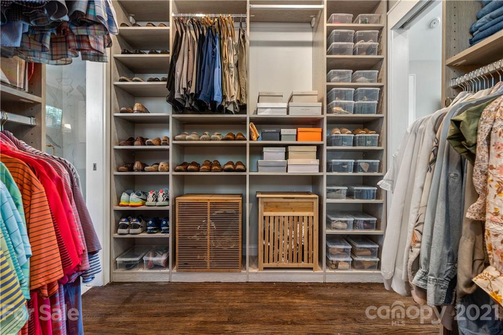 1305 Lilac Road Charlotte, NC 28209 - Photo 33 of 47 a view of walk in closet with clothes and shoes