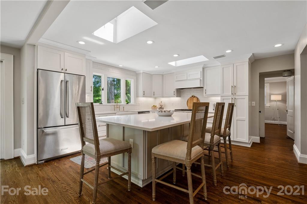 1305 Lilac Road Charlotte, NC 28209 - Photo 35 of 47 a view of a dining room with furniture and wooden floor