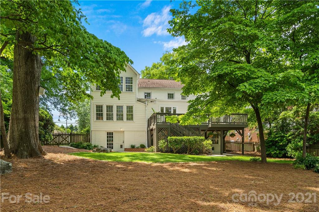 1305 Lilac Road Charlotte, NC 28209 - Photo 38 of 47 a front view of a house with a yard and garage