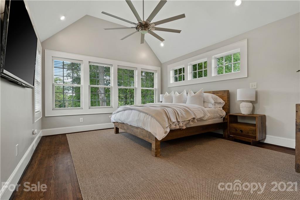 1305 Lilac Road Charlotte, NC 28209 - Photo 5 of 47 a spacious bedroom with a bed and a large window