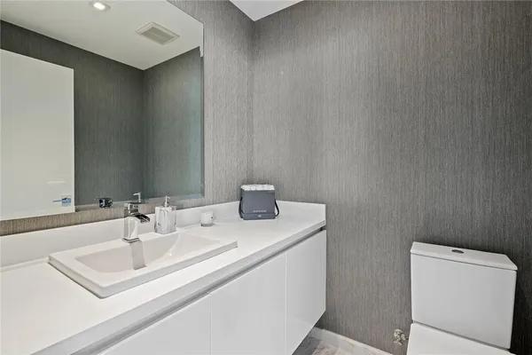 a bathroom with a sink and a toilet