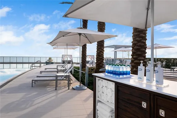 a patio with a table and chairs