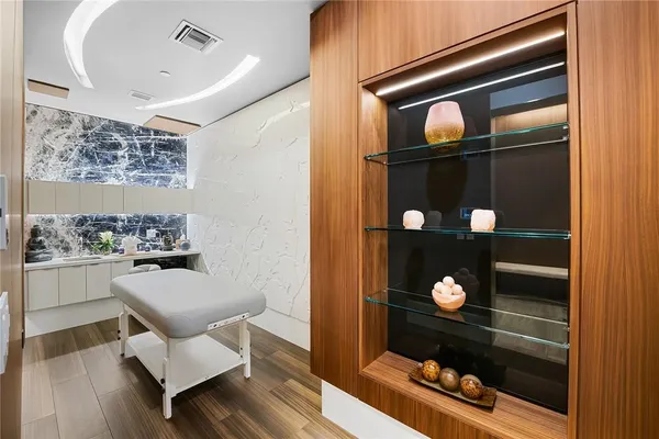 a view of a kitchen with microwave and cabinets