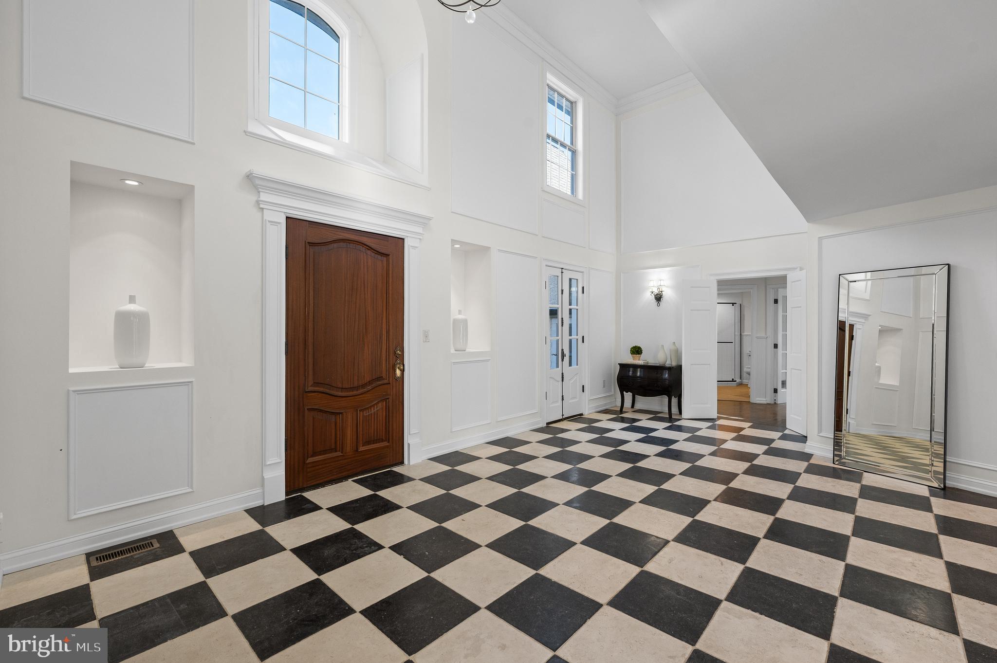 115 Jaffrey Road Malvern, PA 19355 - Photo 2 of 46 a view of a storage & utility room with a washing machine checkered tile floor